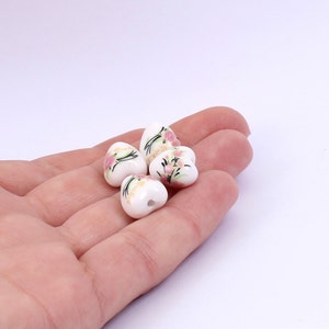 4 x Ceramic Heart Shaped Beads, White Floral Ceramic Heart Beads, 12mm x 11mm, by Jewellery Making Supplies London ( JMSLondonCo )