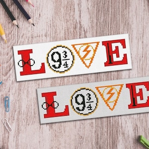 May include: Two white bookmarks with red and black lettering spelling "LOVE" with a 9 3/4 platform and lightning bolt symbol between the letters.