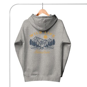 May include: A gray hooded sweatshirt with a graphic print on the back. The graphic features a mountain range, a sun, a deer, and the text "WILD LIFE Adventures".