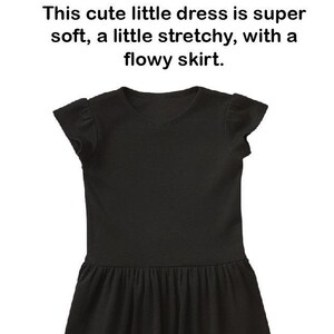 May include: A black infant and toddler dress with short, ruffled sleeves and a flowy skirt. The dress is made of a soft, stretchy fabric. "Infant and Toddler Dress" is written above the dress. "This cute little dress is super soft, a little stretchy, with a flowy skirt." is written below the dress.