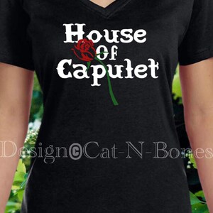 May include: Black v-neck t-shirt with white text that reads "House of Capulet" and a red rose graphic.