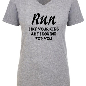 May include: Gray V-neck t-shirt with the text "Run like your kids are looking for you" in black.