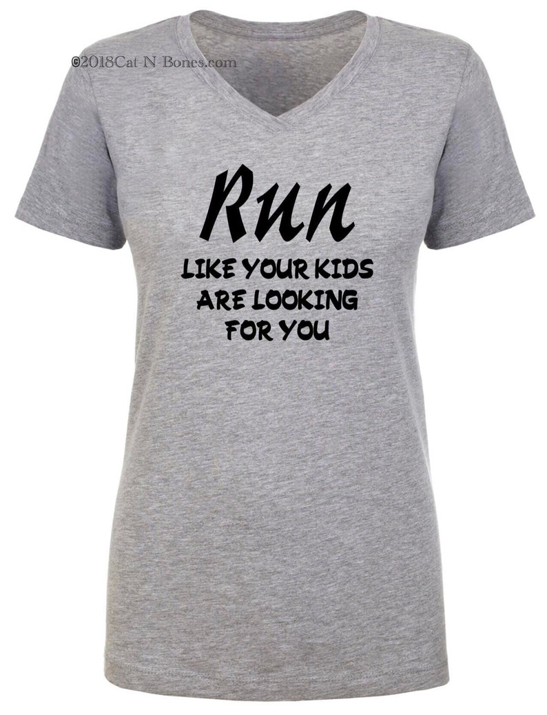 May include: Gray V-neck t-shirt with the text "Run like your kids are looking for you" in black.