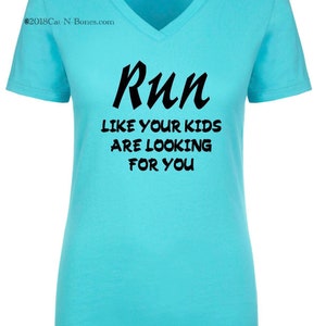 May include: A turquoise blue v-neck t-shirt with the text "Run like your kids are looking for you" printed in black.