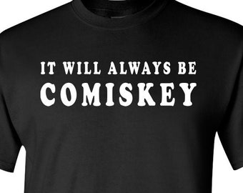 May include: Black t-shirt with white text that reads "It will always be Comiskey"