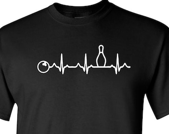 May include: Black t-shirt with a white graphic of a bowling pin and ball with a heartbeat line.