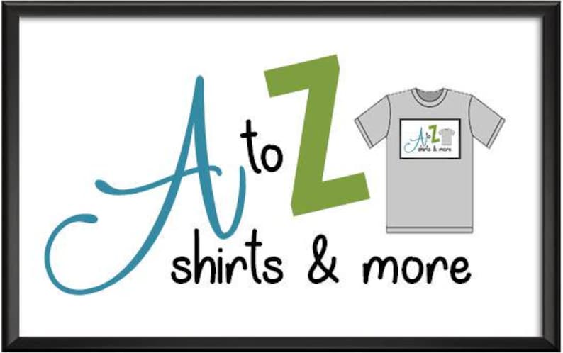 May include: A to Z shirts & more logo with a blue cursive A and a green Z. A grey t-shirt with the logo printed on it.