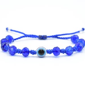 May include: A blue string bracelet with a blue evil eye charm and blue glass beads.