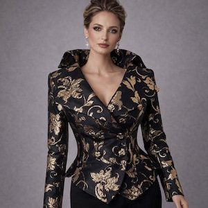 May include: A black jacket with gold floral brocade. The jacket has a wide collar, a double-breasted closure, and a fitted waist. The long sleeves and fabric have a subtle sheen. The jacket is a formal garment.