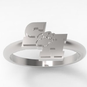 May include: A silver ring with the letters "SA" and a paw print in the center.