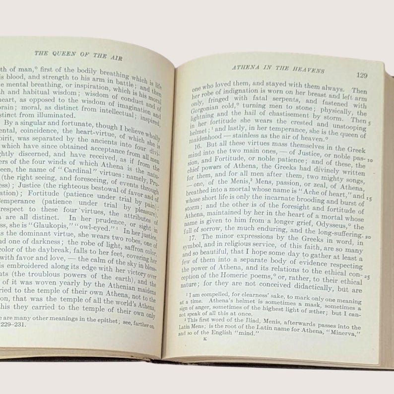 May include: Open book with text on aged paper. The pages display text about Athena and the Queen of the Air. The text is in English and is from an older publication.