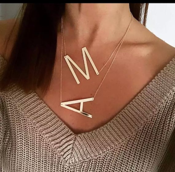 Large sideways letter necklace deals