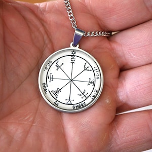 May include: A white ceramic mug with a black handle and the text "But First, Coffee" in a black, bold font. The mug is on a white surface.