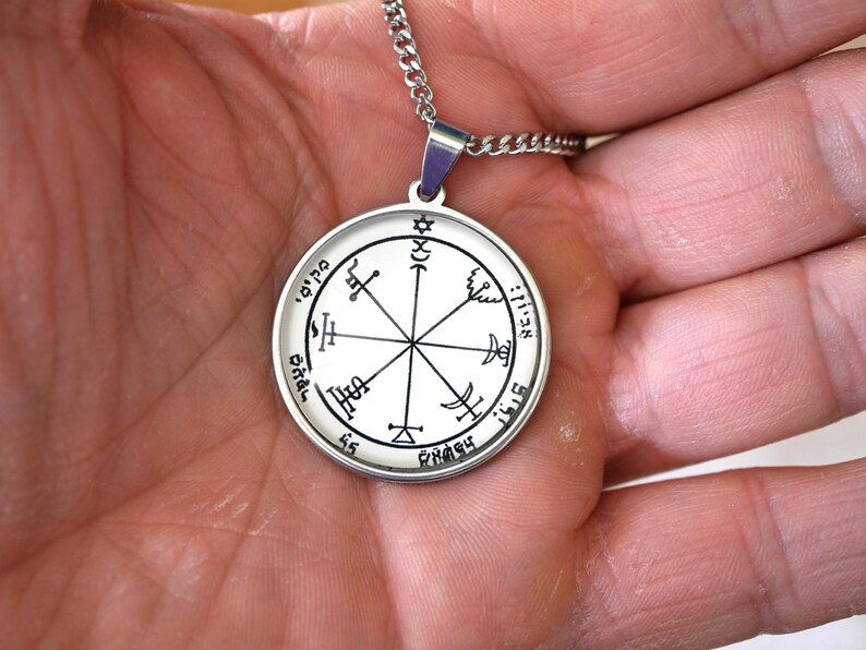 May include: A white ceramic mug with a black handle and the text "But First, Coffee" in a black, bold font. The mug is on a white surface.