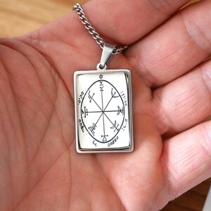 May include: A white ceramic mug with a black handle and the text "But First, Coffee" in a black, handwritten-style font. The mug is on a white surface.