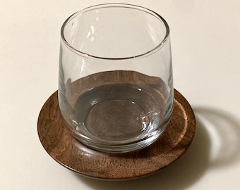 Glass coffee cup with wooden saucer