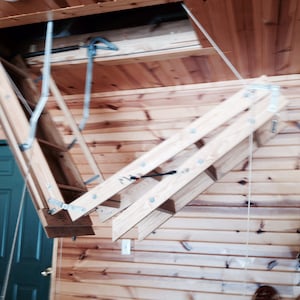 Heavy Duty Attic Ladder Pulley System for 10’-12’ ceilings. Great for the elderly to operate. Attic ladder is not included.