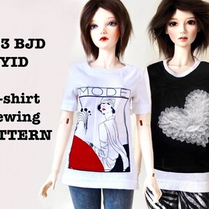 May include: A white t-shirt sewing pattern for 1/3 BJD YID dolls. The shirt features a graphic of a woman with the word "MODE". Another doll wears a black top with a white heart design.
