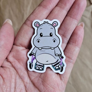 Nimbo Walker Hippo (inclusione, impianto DBS, cicatrici, AFO, plantari caviglia-piede, dispositivi assistivi, bisogni speciali, adesivo impermeabile)