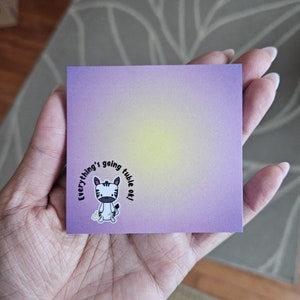 May include: A purple and yellow gradient sticky note with a black and white zebra cartoon illustration. The zebra is holding a small yellow egg and the text around it reads "Everything's going tuble out!"