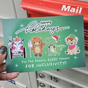 May include: A green holiday greeting card with the words "Happy Holidays" in white script. The card features cartoon animals: a unicorn, bear, dinosaur, and dog. Text at the bottom reads "Tis The Season, EVERY Season FOR INCLUSIVITY!"