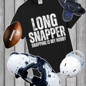 May include: Black t-shirt with the text "LONG SNAPPER SNAPPING IS MY HOBBY" in white. The image also includes a football, shoulder pads, a helmet, and cleats.
