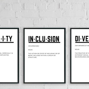 May include: Three black framed prints with white backgrounds and black text. The prints define the words "Equality", "Inclusion", and "Diversity" with their definitions below.