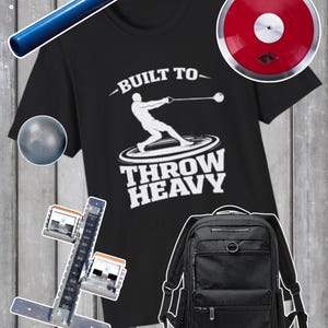 May include: A black t-shirt with the text "BUILT TO THROW HEAVY" and a graphic of a hammer thrower. Also shown are a blue pole, a red discus, a black backpack, a shot put, and a starting block.