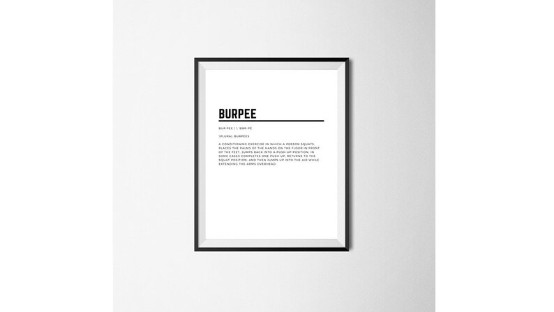 May include: A black and white printable poster with the word "Burpee" in bold text and a definition of the exercise. The poster is framed in a black frame.