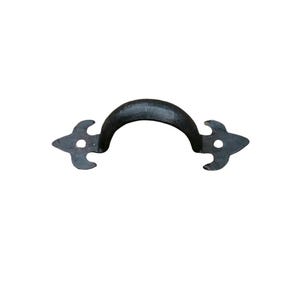 May include: A black, wrought iron handle with a curved grip and decorative, pointed ends. The handle is designed for a cabinet or drawer and has a rustic, vintage aesthetic. The handle is approximately 15 cm long.