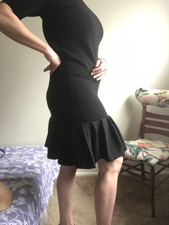Black matching sweater skirt and top