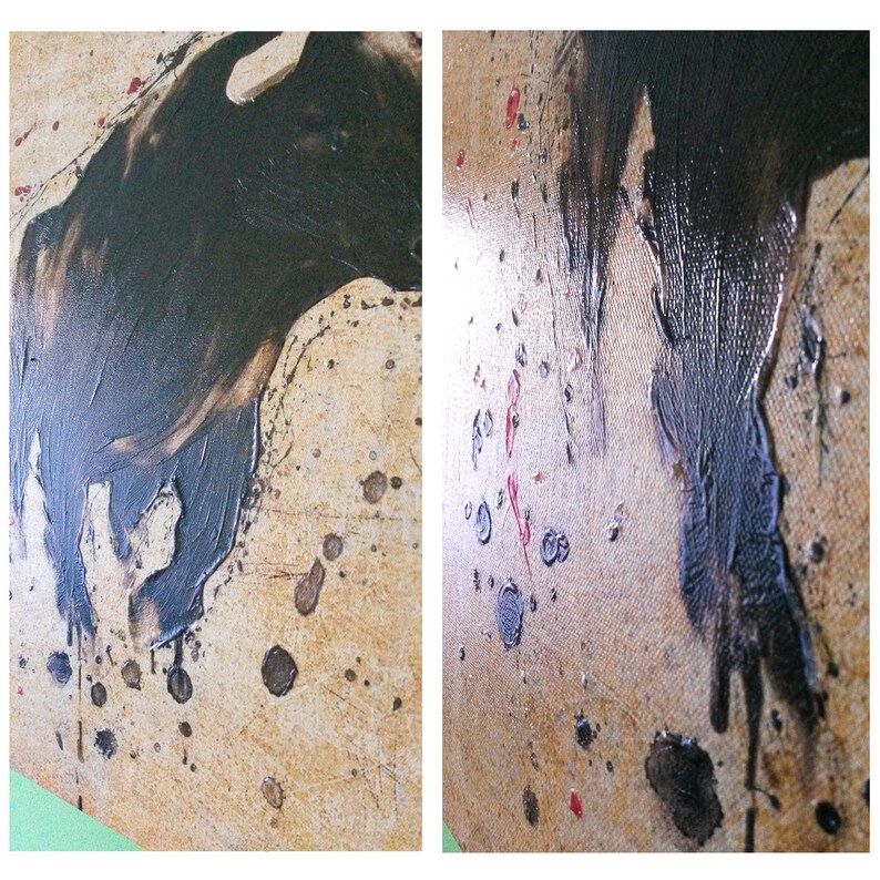 May include: Abstract painting on canvas with black paint splatters and drips on a beige background. The black paint is thick and textured, creating a dynamic and expressive piece.