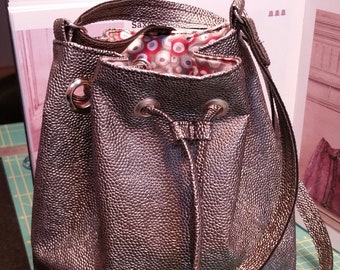 Brown faux leather purse bag, lined with shoulder strap