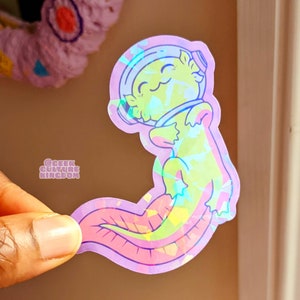Adesivo olografico in vinile con astronauta axolotl verde