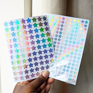 Folha de adesivos holográficos de vinil com estrelas prateadas e arredondadas. Adesivos para bullet journal.