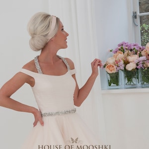 House of Mooshki original sample Lauretta. A cute oyster vintage tea length wedding dress with beaded halter neckline.