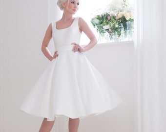 Effie is a Modern mikado satin short wedding dress for a sleek and understated look  in Ivory