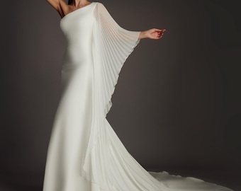 Linnea is a Asymmetric Ivory Crepe Mermaid wedding dress with pleated chiffon sleeve in Ivory