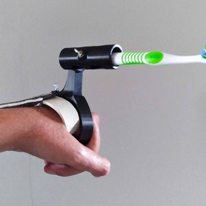 Adaptive Toothbrush Holder