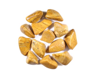 May include: A collection of 12 tumbled yellow and brown jasper stones. The stones are smooth and polished, with a variety of shapes and sizes.