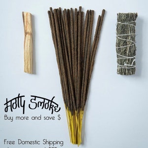 May include: An assortment of incense sticks with yellow tips, a piece of palo santo wood, and a bundle of sage, all arranged on a white background. The text "Holy Smoke" is visible, along with the phrase "Buy more and save $".