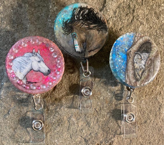 Painted original art on resin retractable badge reels- only 1 each available
