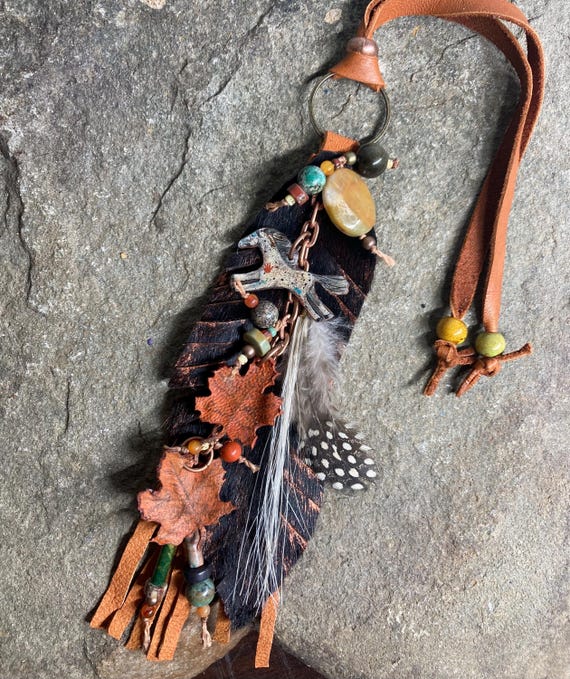 Autumn themed hair on hide feather hanging charm with painted leather fall leaves / western horse art bag decor