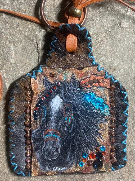 Leather and rhinestones painted war pony ear tag