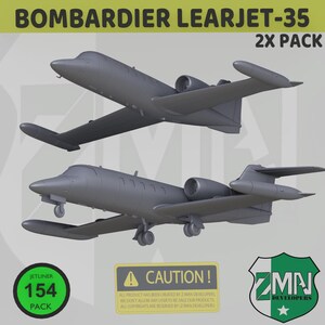 May include: Two gray Bombardier Learjet-35 model airplanes are displayed. The image includes text that reads "BOMBARDIER LEARJET-35 2X PACK", "JETLINER 154 PACK", and a caution notice. The Z MAN DEVELOPERS logo is also visible.