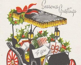 Pre-owned 1950s Christmas card featuring old-fashioned surrey filled with gifts and holly