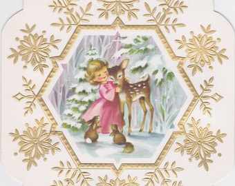 Vintage 1960s card with unusual snowflake shape and design featuring angel with forest creatures