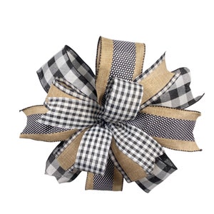 May include: A black and white checkered ribbon bow with a brown burlap ribbon. The bow is tied in a knot and has a rustic look.