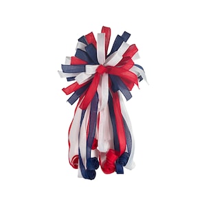 May include: A large red, white, and blue bow made of ribbon. The bow is tied in a knot and the ends of the ribbon are curled.