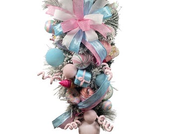 Pastel Candyland Christmas Teardrop Door Hanger with Pink and Blue Ribbons Whimsical Holiday Decor.